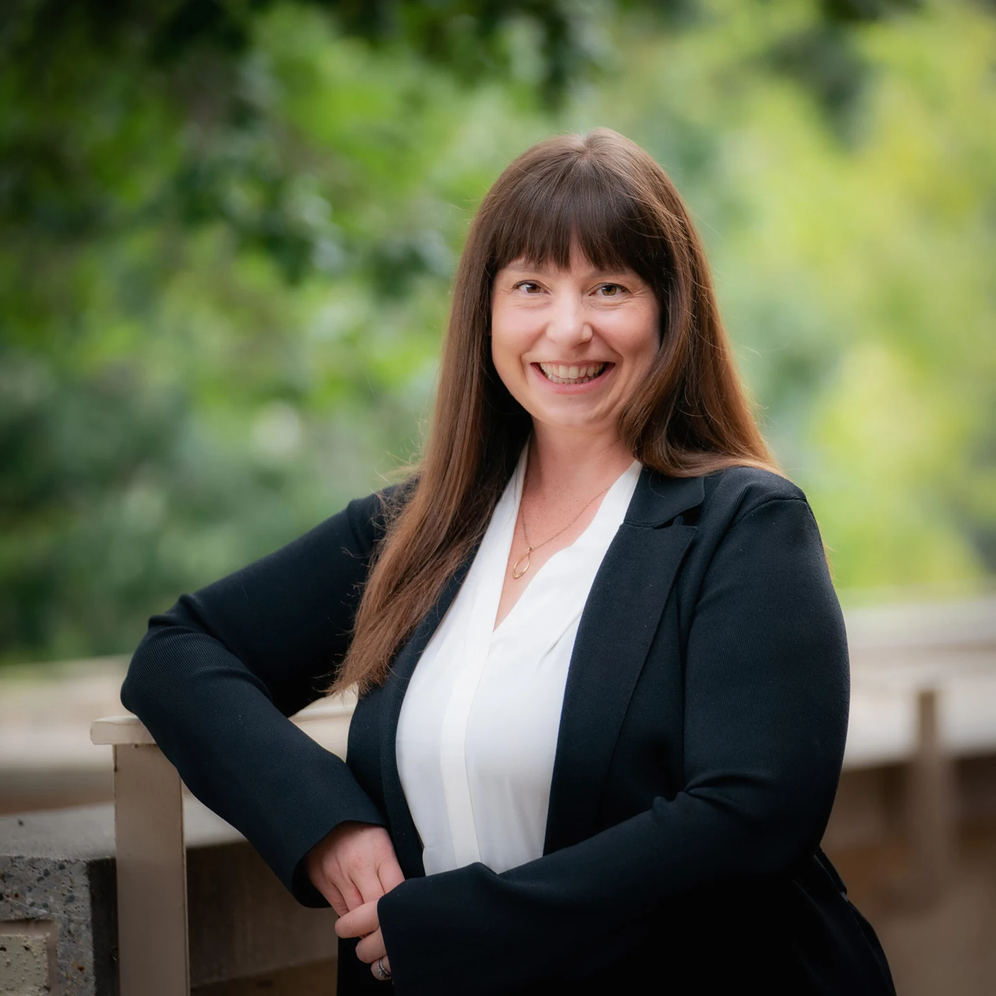 A photo of Dr. Marsh leaning against a railing.