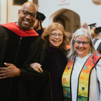 A photo of three trustees during Commencement.