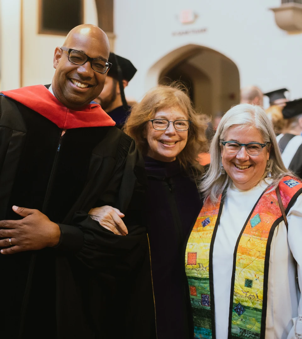 A photo of three trustees during Commencement.