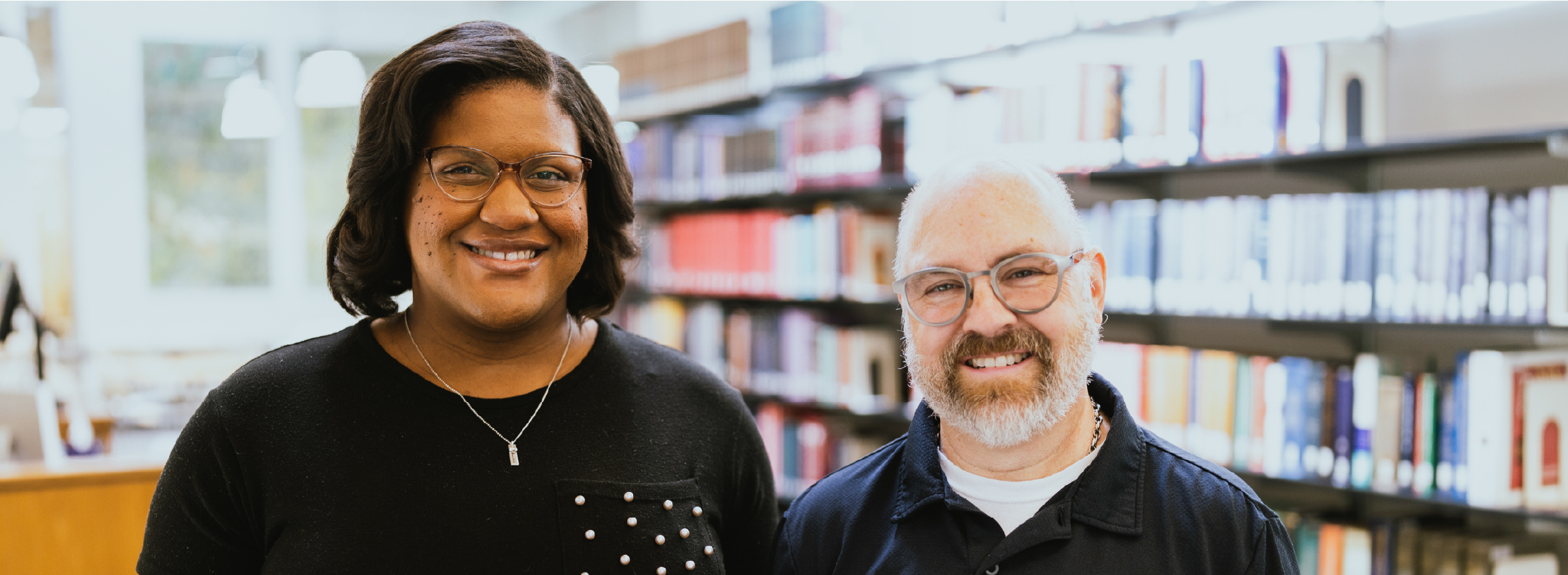 Two professors in the library.