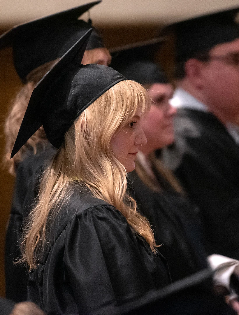 Graduates sit during commencement.