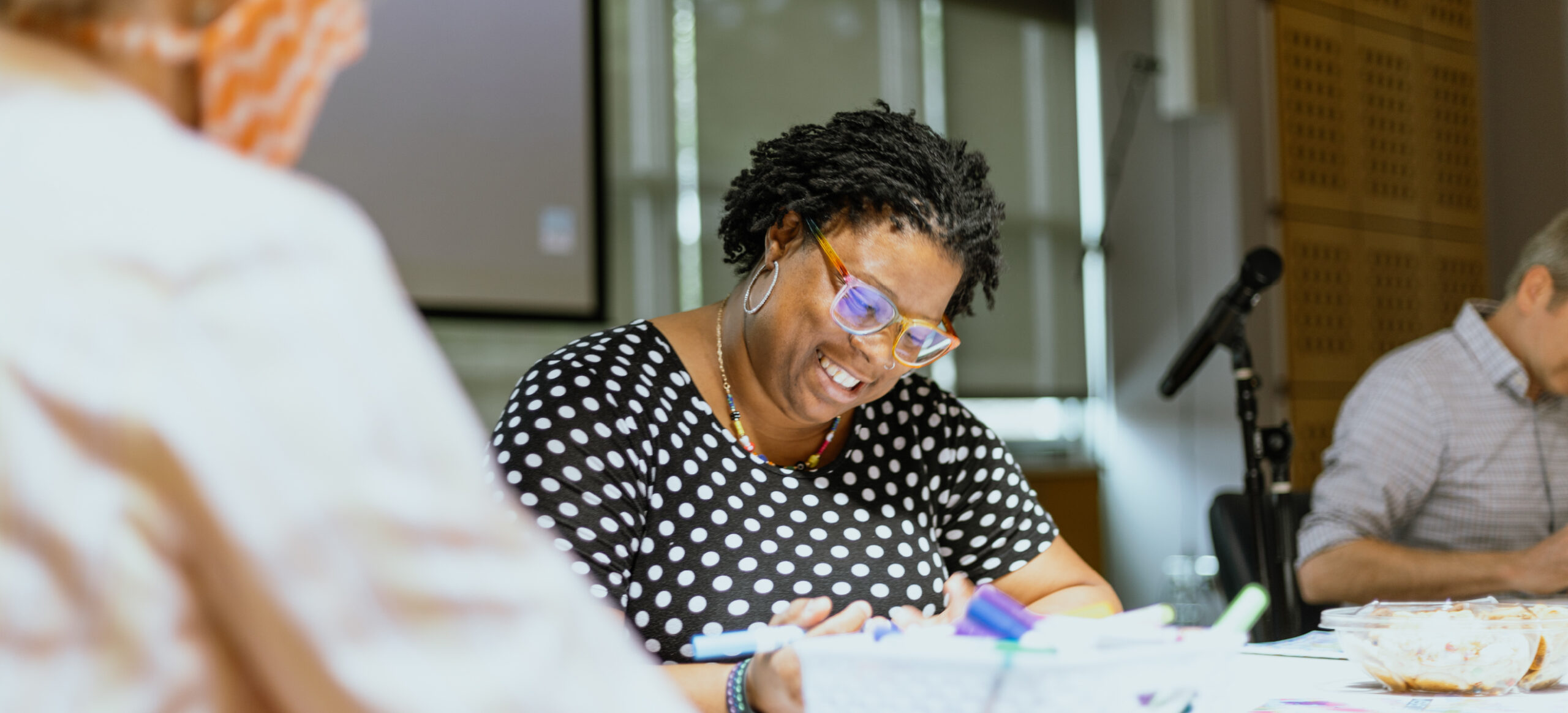 Rev. Nikki Frontz writes something down.