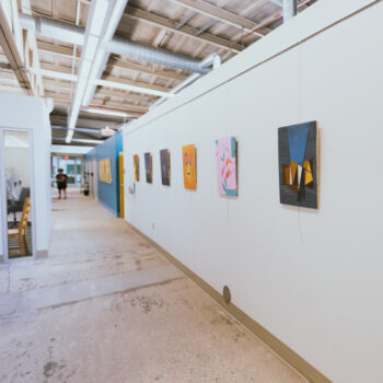 A hallway on campus containing art.