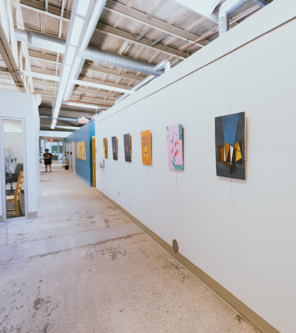 A hallway on campus containing art.