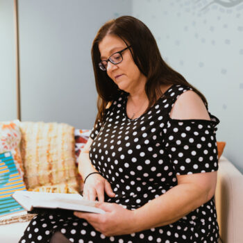 A student reads from a book.