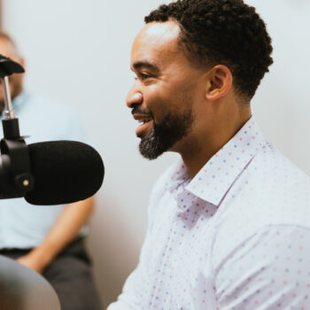 Rev. Dr. Gary F. Green II speaks into a podcast mic.