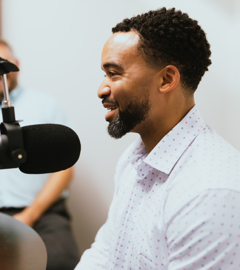 Rev. Dr. Gary F. Green II speaks into a podcast mic.