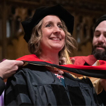 A photo of a DMin graduate receiving her hood.