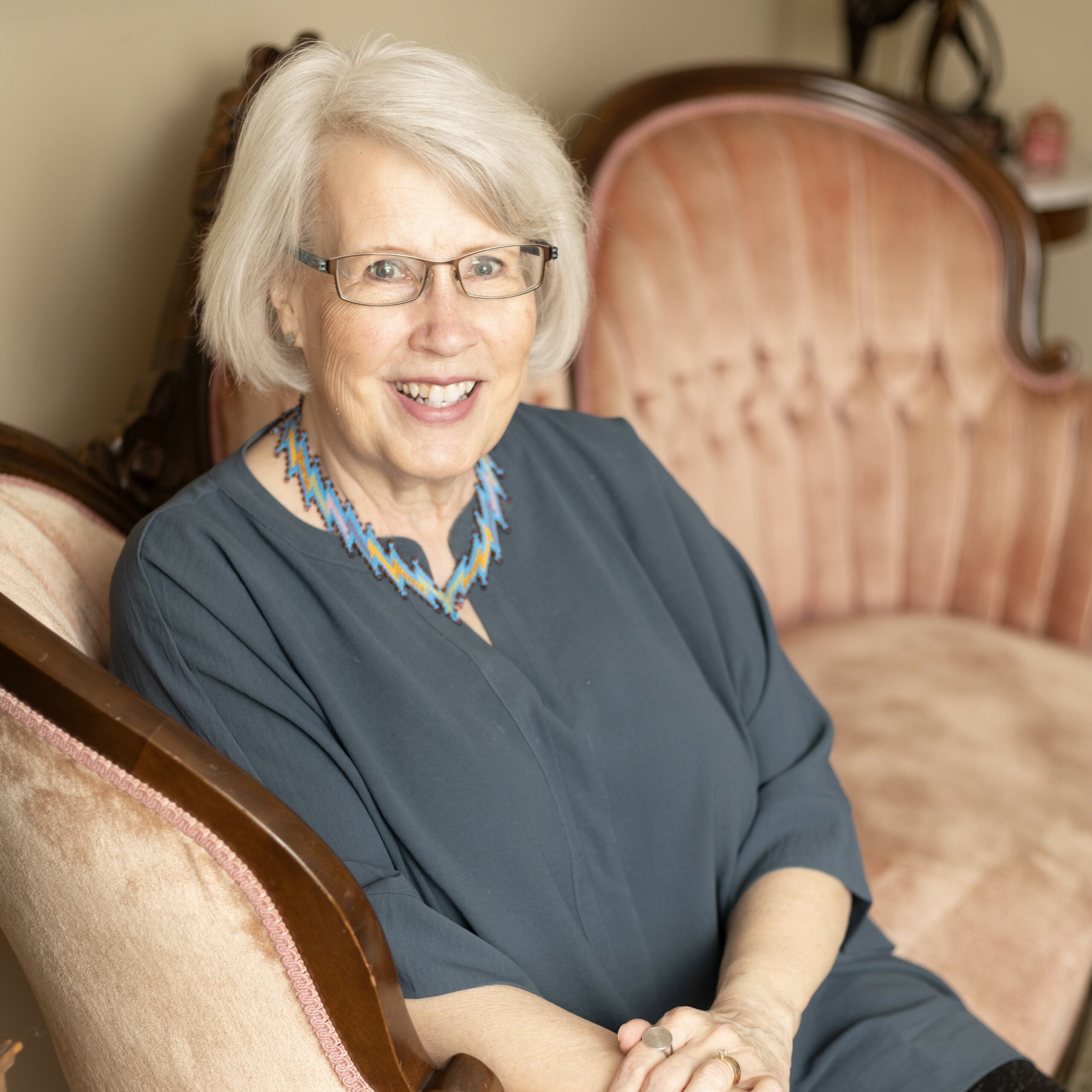 Smiling person sitting on couch